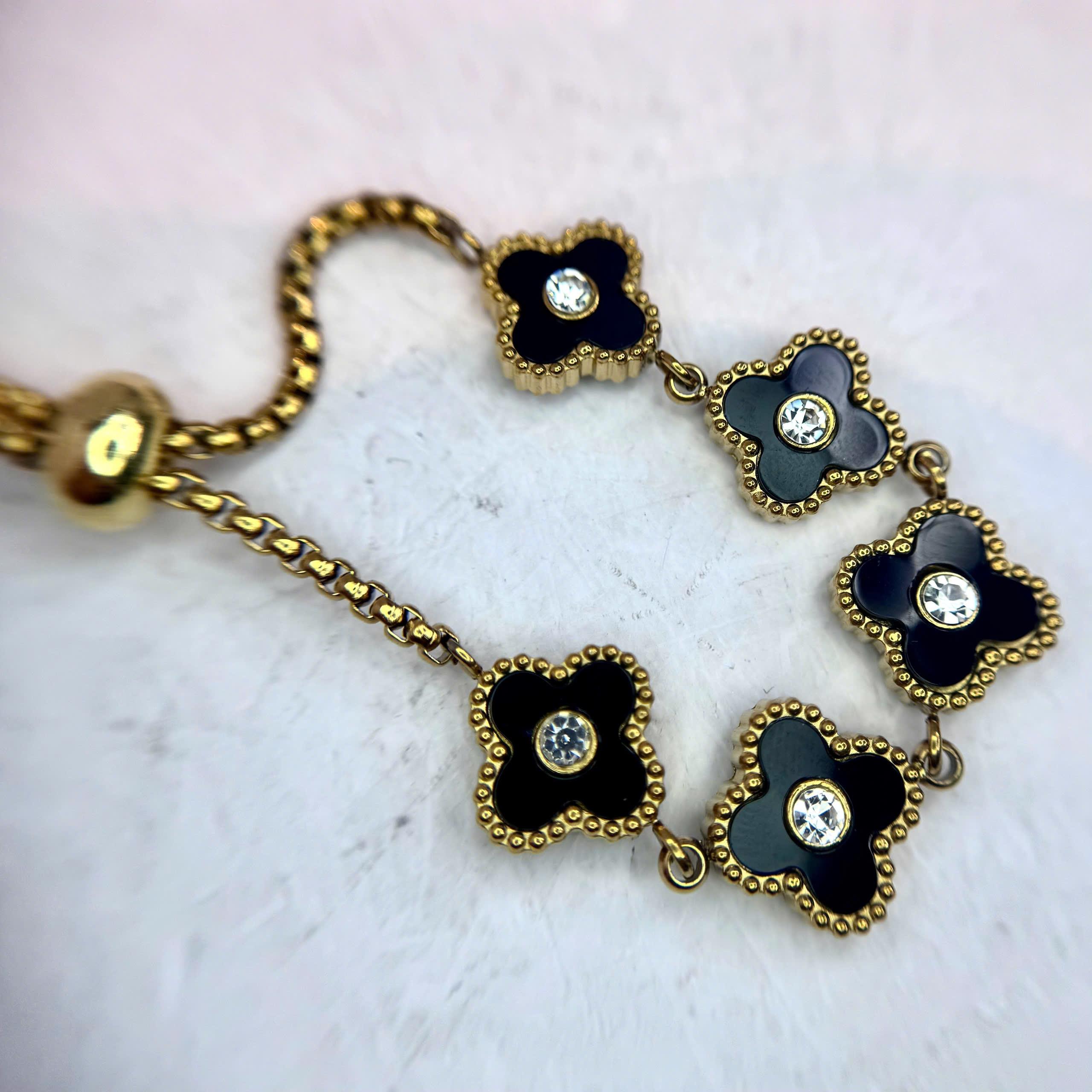 Vòng tay cỏ 4 lá đen dây vàng rút hợp kim_thumbnail_2