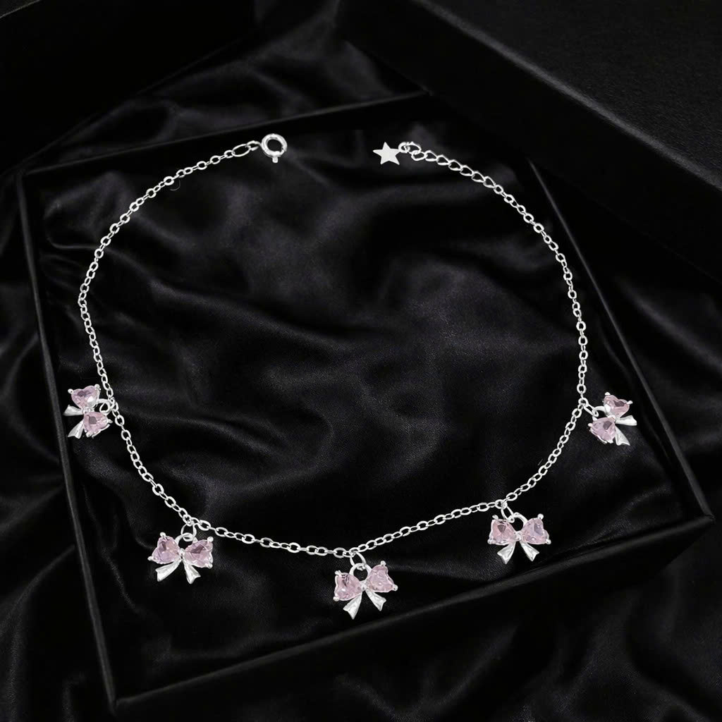 Vòng tay bạc xi kim nơ tim hồng