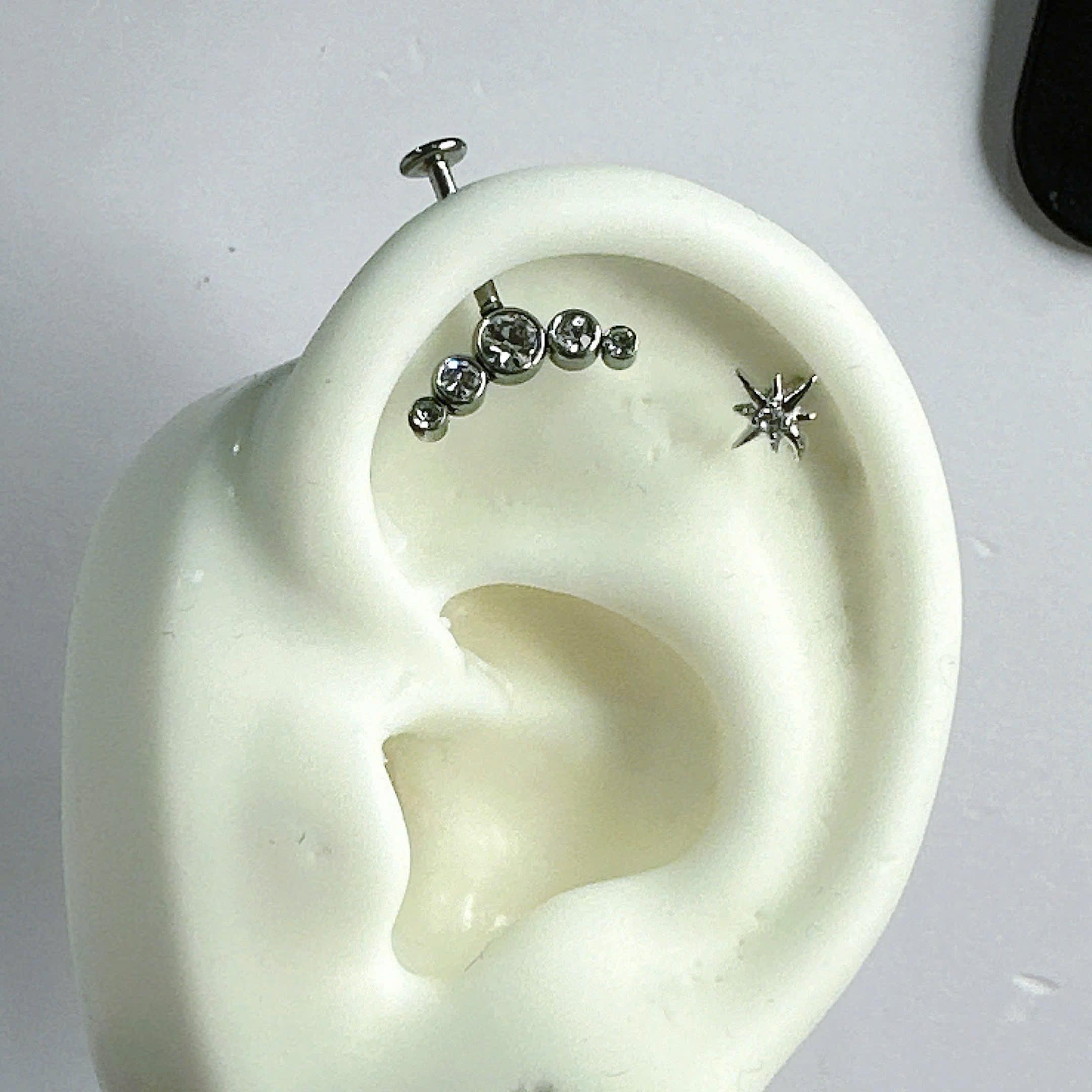 Khuyên kiểu vertical vòm đá thân pin